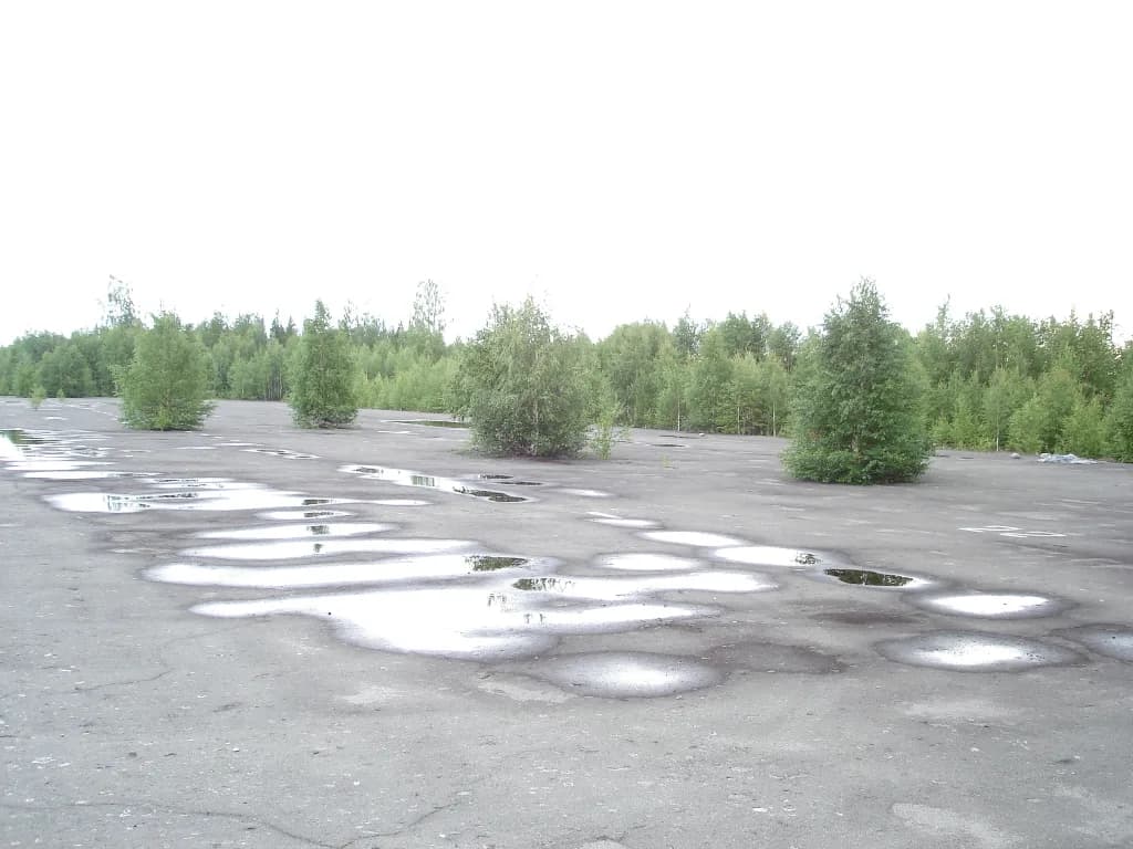 Aerial view of Khariusny Air Base (closed) airport infrastructure